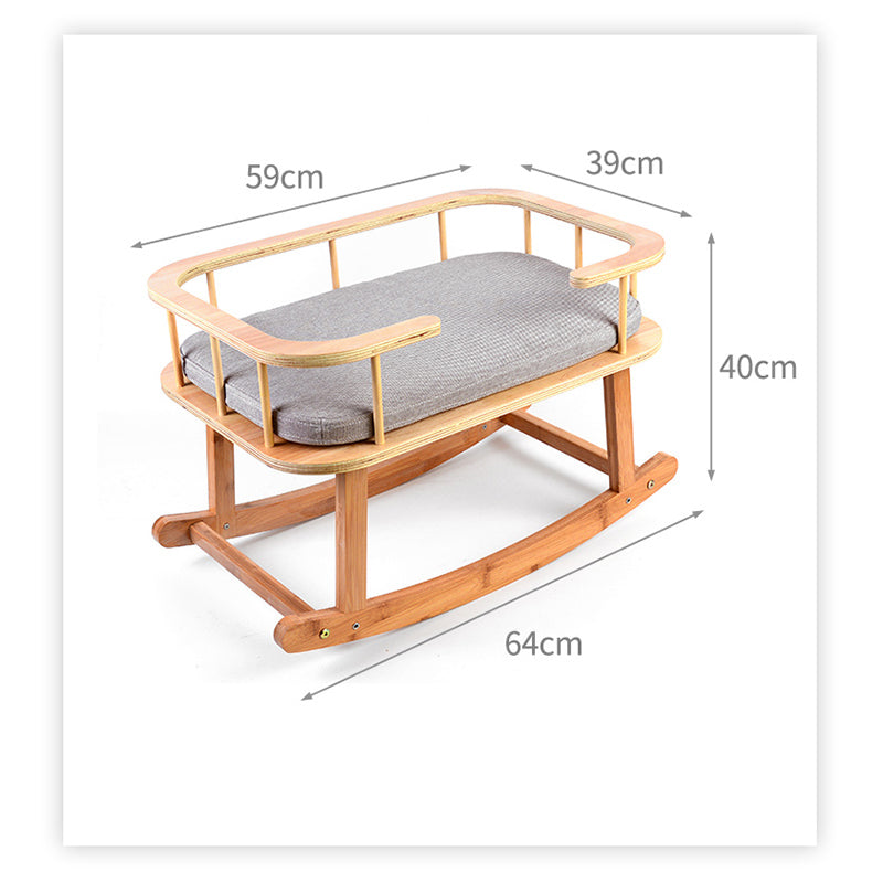 Wooden baby rocker with gray cushion and dimensions labeled